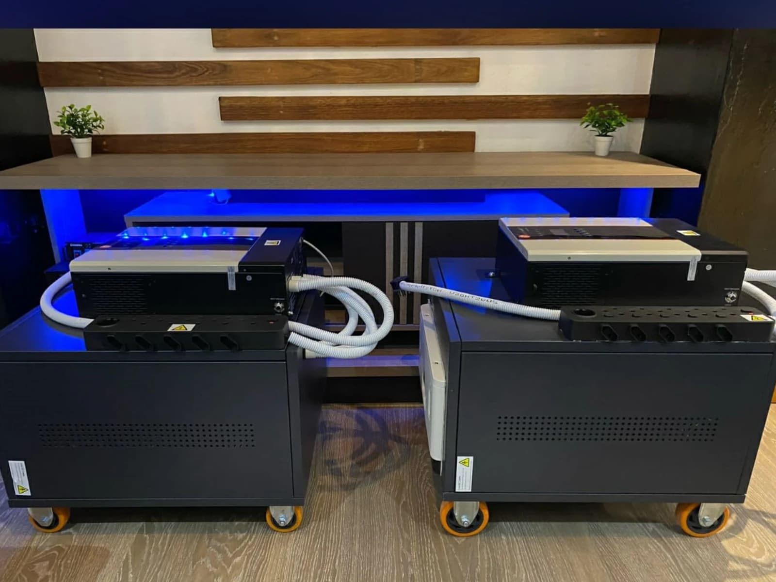 Mobile residential backup trolley system with inverter and battery units on wheels.